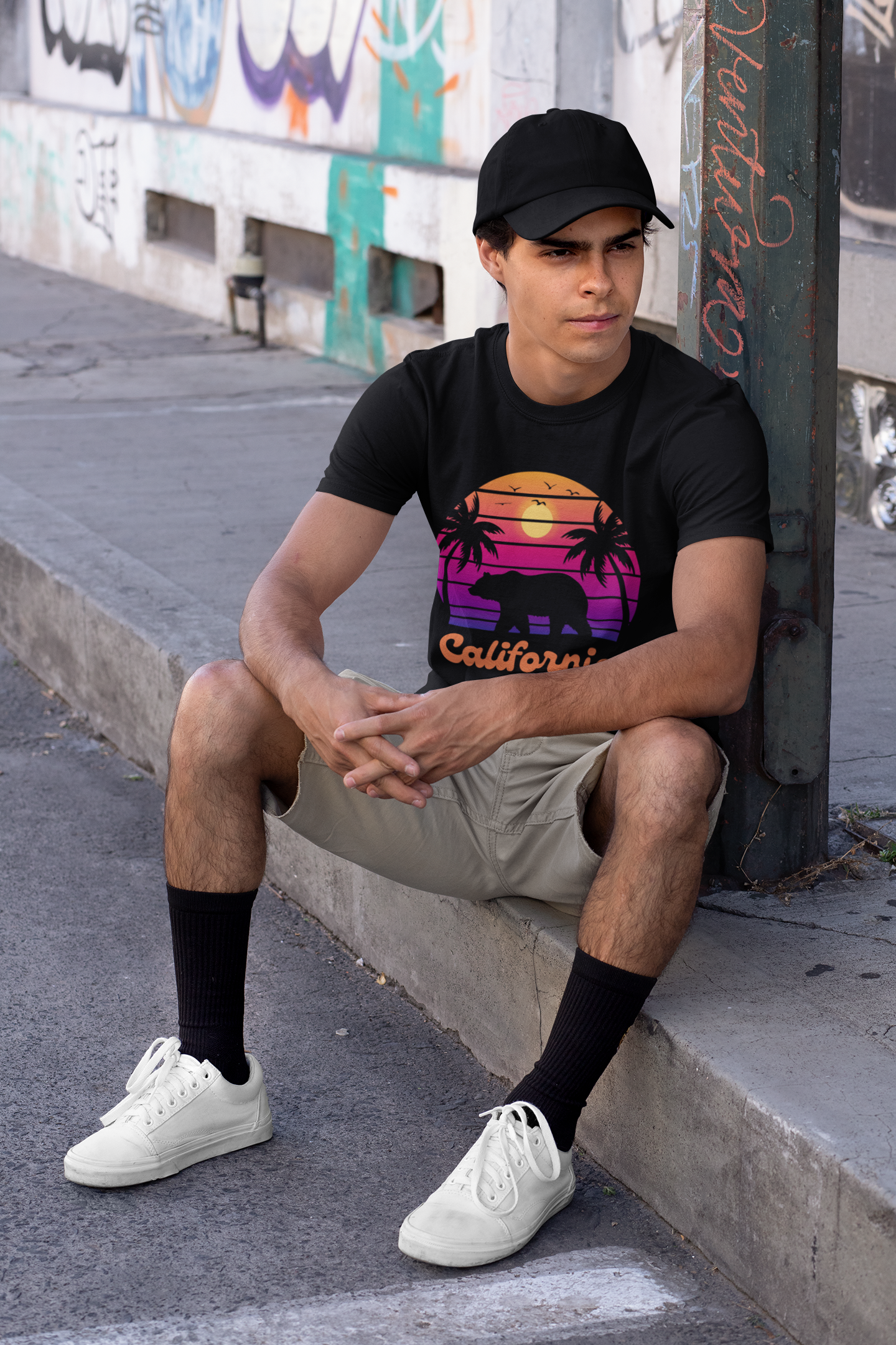 young man in an urban setting wearing a california bears sunset shirt